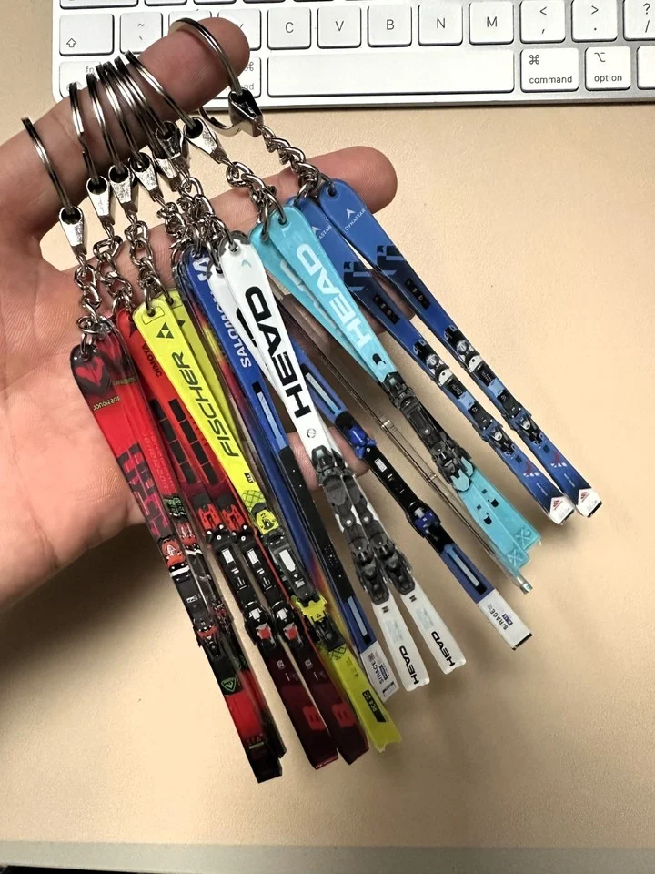 A handful of colourful Summit Supply MiniSkis keyrings